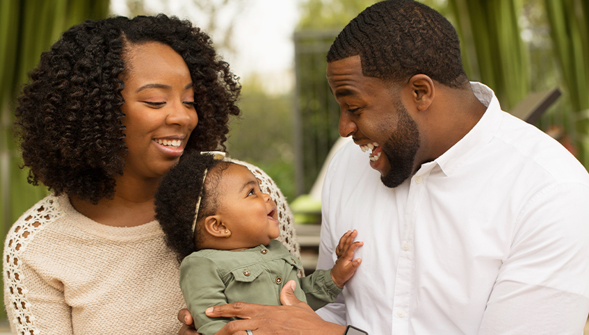 Family embracing young child